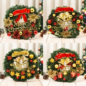 Christmas pine needle wreaths with red bows, gold bells and Merry Christmas signs