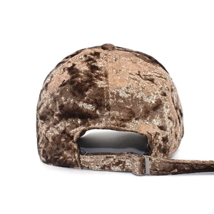 Detail of velvet baseball cap with adjustable metal buckle and soft plush texture