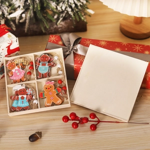 Set of 12 festive wooden gingerbread man ornaments in a natural pine storage box