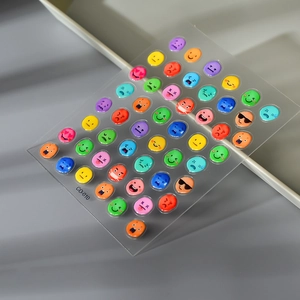 3D colorful emoji bubble nail stickers with smiley faces on clear plastic sheet