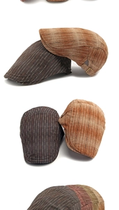 Détail de la casquette rayée vintage montrant la texture et la boucle métallique