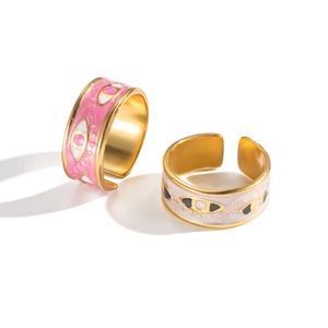 Adjustable gold plated evil eye rings with pink and cream enamel in a two-piece set