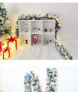Detail of flocked Christmas garland with warm LED lights, blue ornaments and pine cones