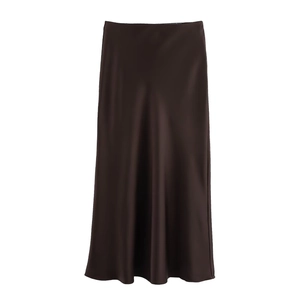 Detailed view of the smooth, lustrous dark brown satin fabric and high-waisted skirt texture