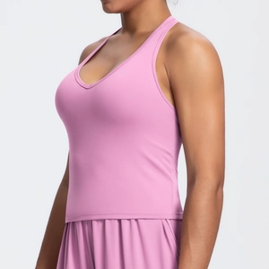 Close-up of pink V-neck sports bra showing premium brushed texture and elastic fabric