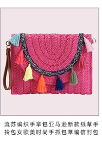 Detail of fuchsia woven straw clutch bag with colorful tassels and leather wristlet strap