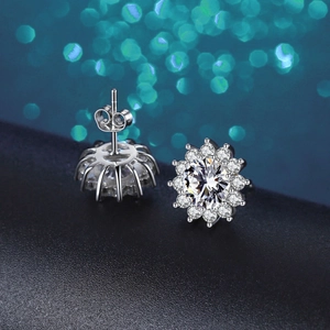Detailed view of 925 sterling silver moissanite earrings with sunburst flower setting
