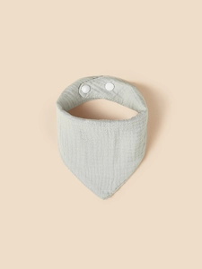 Detail of light grey cotton gauze baby bib with adjustable white snap buttons
