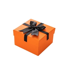 Elegant orange square watch gift box with black ribbon bow on white background
