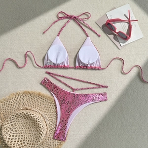 Detailed flat lay of pink leopard bikini with padded cups and adjustable side ties
