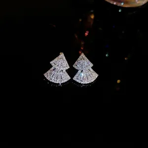 Elegant fan-shaped sterling silver stud earrings with shimmering cubic zirconia stones