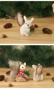 Detailed view of handcrafted rush squirrel ornaments with pine cones and festive scarves