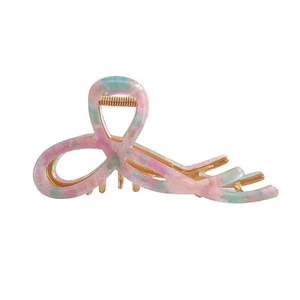 Pink and green marble patterned acetate hair claw clip with cutout bow design for thick hair