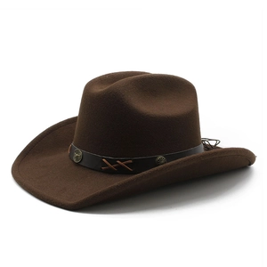 Detail of dark brown western cowboy hat with vintage bull head metal buckle on band