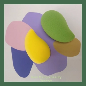 Detailed macro texture of mango-shaped makeup sponges in yellow and green foam