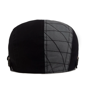 Retro patchwork beret cap in black and grey with geometric stitching and metal buckle