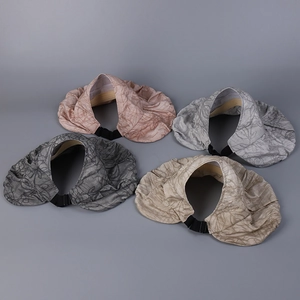 Detail of four floral print sun visors with wide brims and adjustable back straps