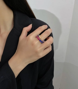 Detail shot of 925 silver eternity rings with colorful 4mm cubic zirconia stones