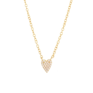 Detailed macro shot of a heart pendant necklace with gold plating and cubic zirconia