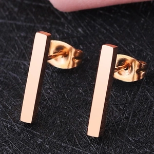 Minimalist geometric bar stud earrings in rose gold finish with polished stainless steel surface
