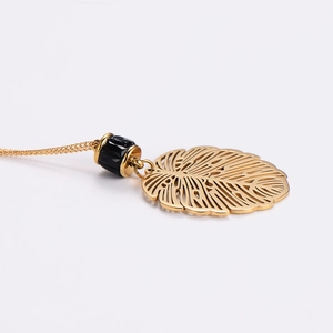 Vintage stainless steel leaf pendant necklace with golden finish and black bead detail