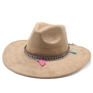 Detailed view of suede wide brim hat featuring heart crown and decorative tassels