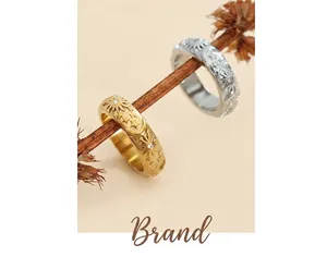 Detail of vintage celestial sun moon rings with zircon on rustic branch base