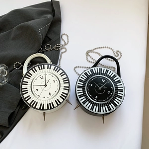 Creative piano and clock round handbags in black and white with metal chain straps