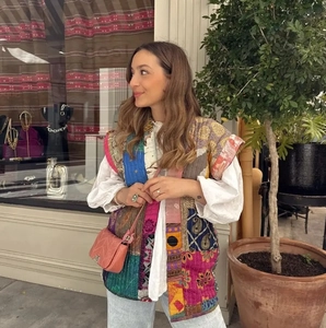 Detailed view of bohemian patchwork quilted cotton vest with sleeveless open front design