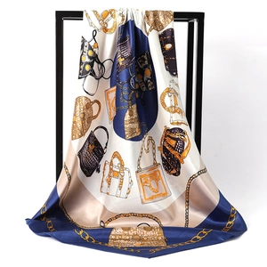 Silky satin square scarf featuring vintage handbag and gold chain prints in navy and cream