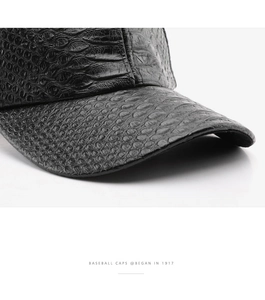 Close-up of black crocodile embossed leather texture on a premium baseball cap