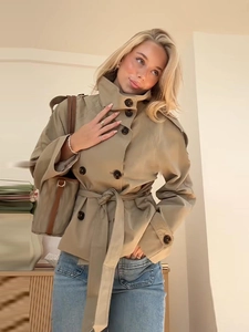 Short khaki double-breasted trench coat with waist belt and epaulettes for women