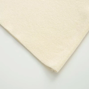 Macro view showing the thick knitted texture and cream white fabric of the women vest
