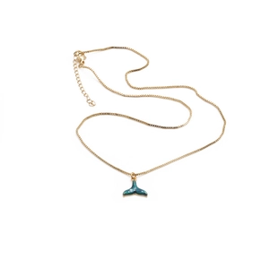 Elegant gold plated mermaid tail necklace with a blue whale tail pendant on white background