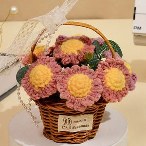 Detail of handmade crochet sunflower basket with pink flowers and cotton soft label