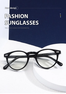 Detail of vintage round black frame glasses with silver metal rivets and CE markings