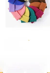 Detailed top-down view of stacked ribbed knit beanies in various vibrant colors