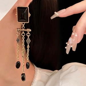 Vintage black square stud earrings with golden tassel chains and oval ceramic beads