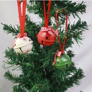 Set of three colorful Christmas metal bells with star cutouts and festive plaid bows