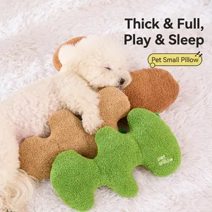 Soft bone-shaped plush pet pillow for dogs and cats in green and brown textured fleece