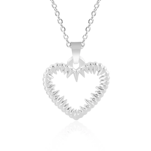Macro detail of silver spiked heart pendant and classic chain on white background