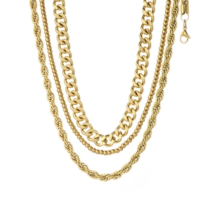 Three-piece gold layered necklace set with cuban, twist, and bead chains on white backdrop