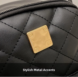 Detailed macro view of black quilted leather bag with a square golden metal buckle