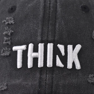 Vintage black washed cotton baseball cap featuring thick white THINK embroidery detail