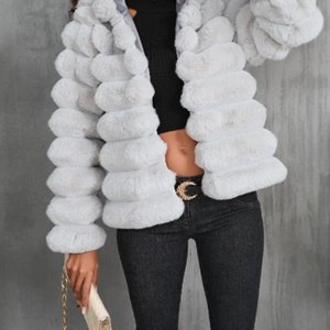 Short faux fur coat for women featuring a layered horizontal design in light grey plush