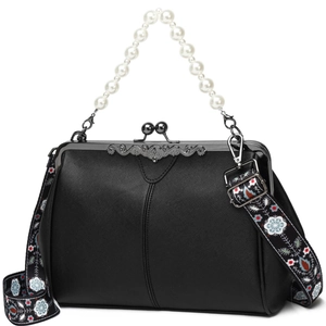 Black textured handbag with pearl handle and floral fabric strap on white background