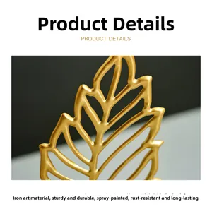 Detail of gold leaf iron ornament with spray paint finish and clear vein texture