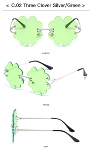 Detail view of green three-clover rimless sunglasses with silver metal temples
