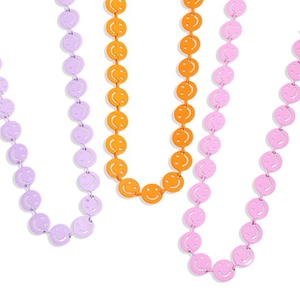 Detail of colorful smiley face link bracelets in purple, orange, and vibrant pink