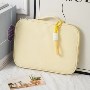 Detailed view of pale yellow 14-inch laptop sleeve with sturdy handle and dual zippers